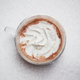 Mug of hot cocoa topped with whipped cream